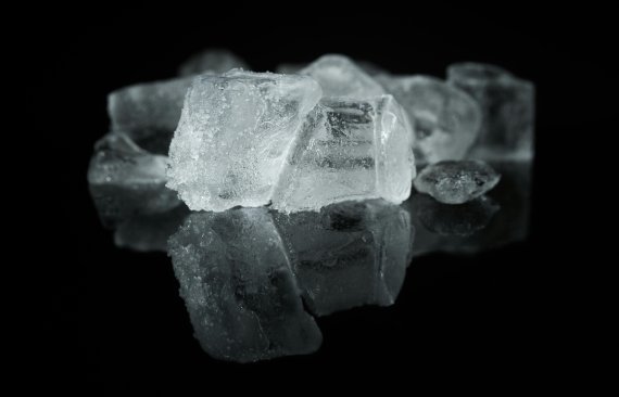 Ice cubes against a black background.