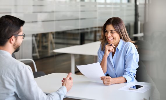 Two people conduct a job interview