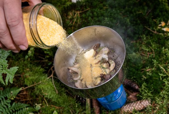 Sven Christ tastes the mushrooms with polenta