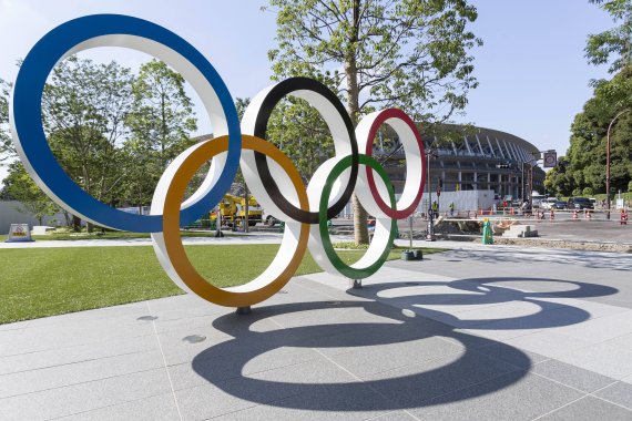 The Olympic rings in front of the new National Stadium in Tokyo - one of the sports venues of the Olympic Games.